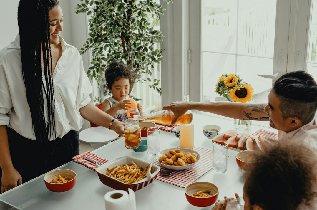 family discussing budget at kitchen table