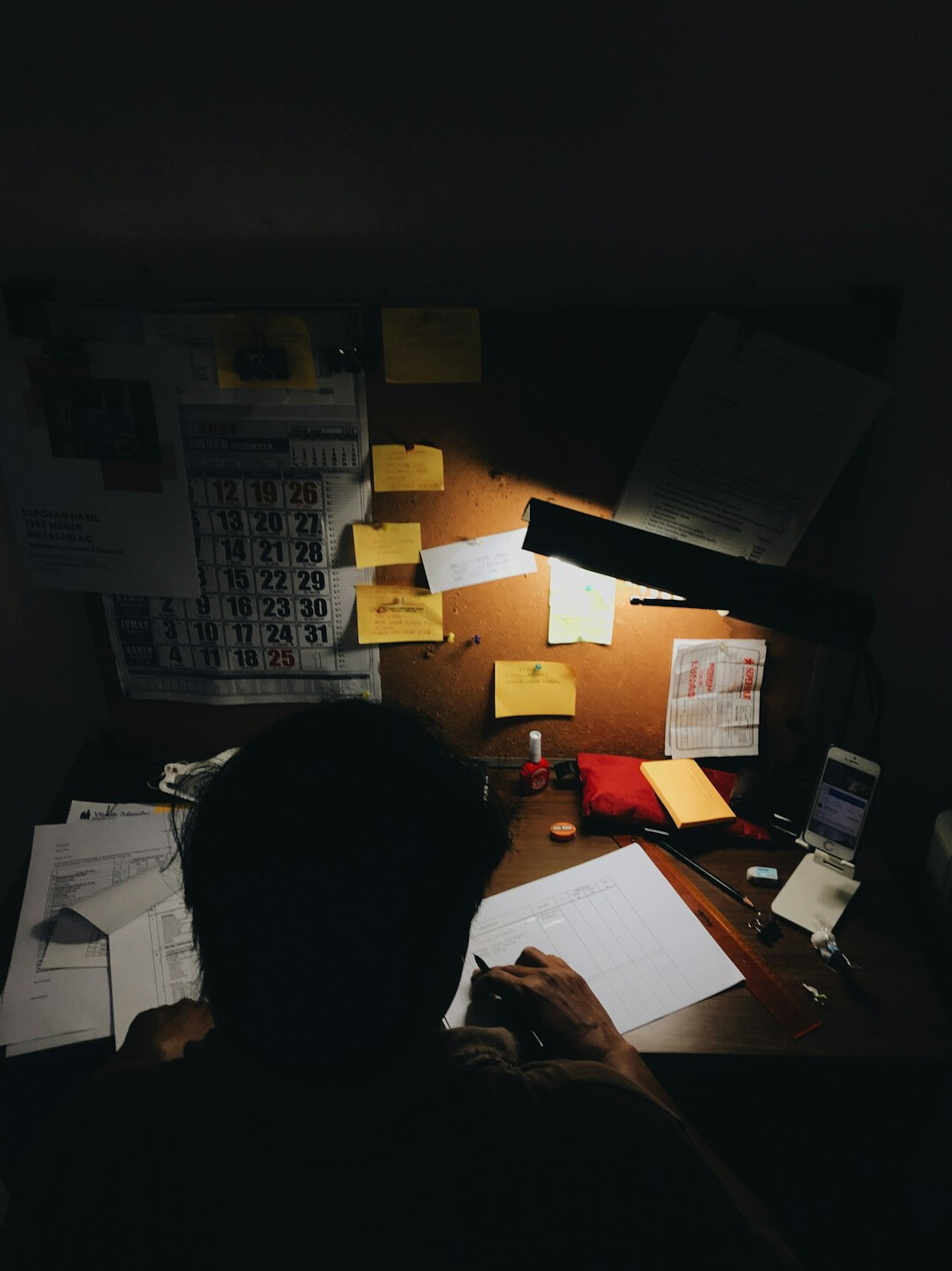 person reviewing bills at desk